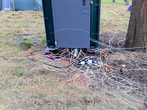 A portable toilet with wires coming out