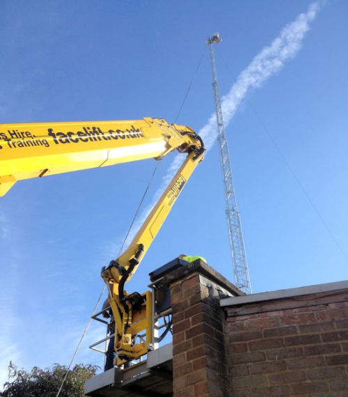 A cherrypicker installing a wireless link at EMF 2014